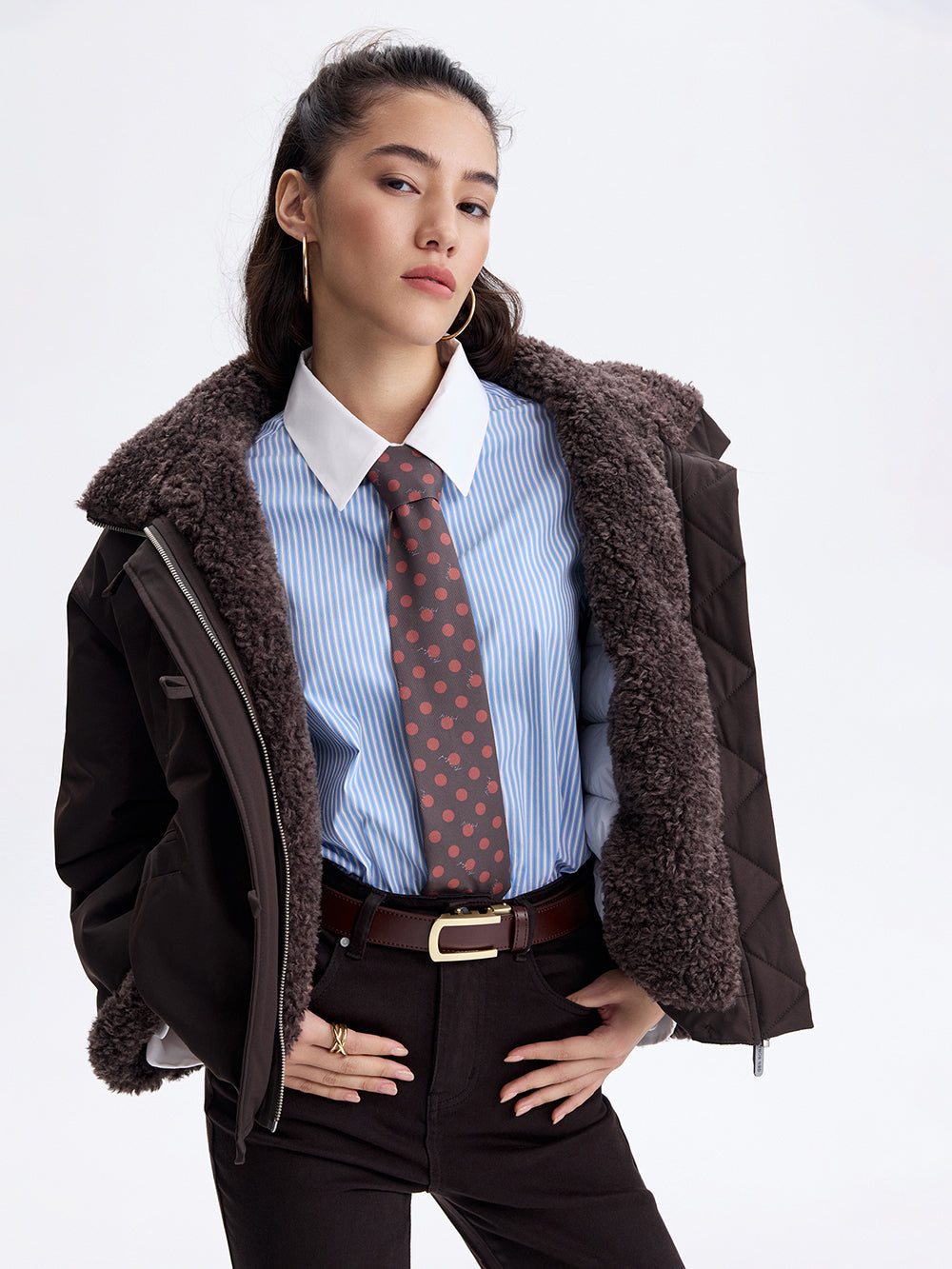 Polka dot silk-lined tie on a blue striped shirt
