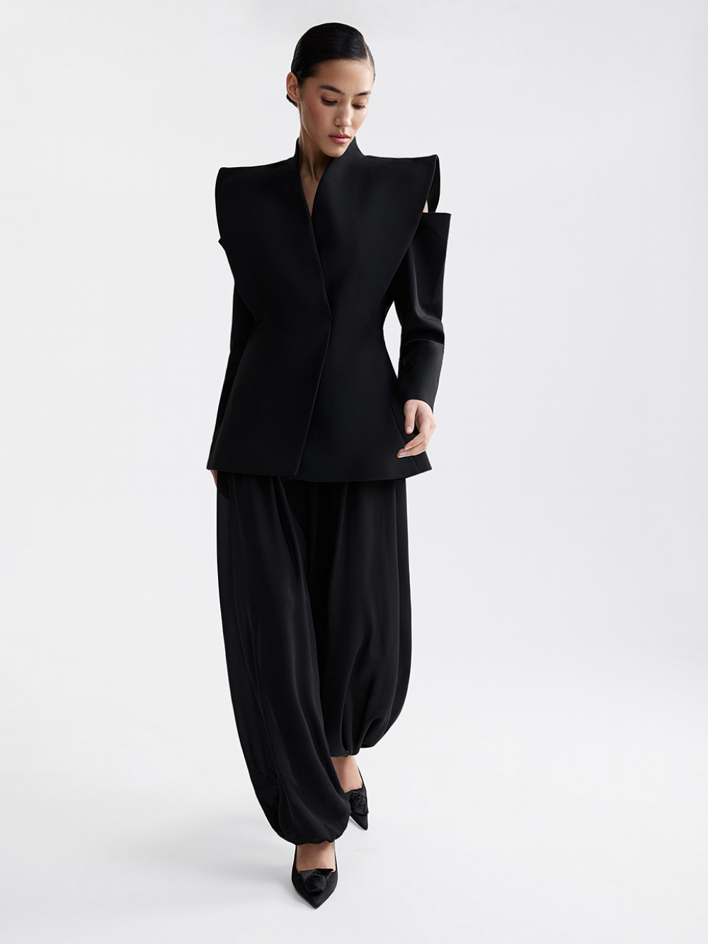 Black tailored jacket with extended shoulder line