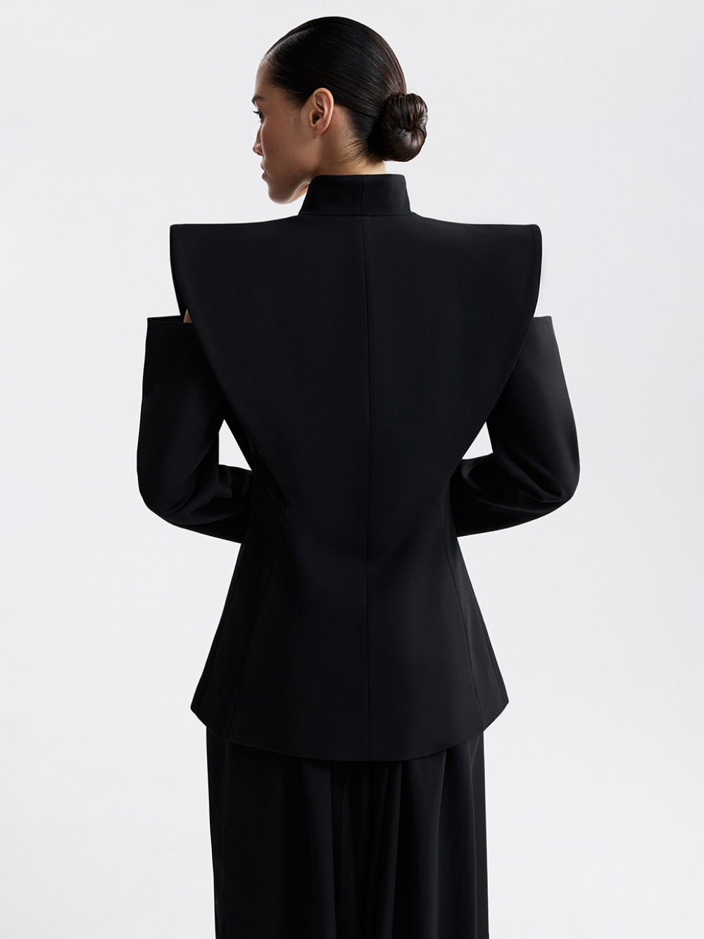 Black jacket with defined waistline, full look