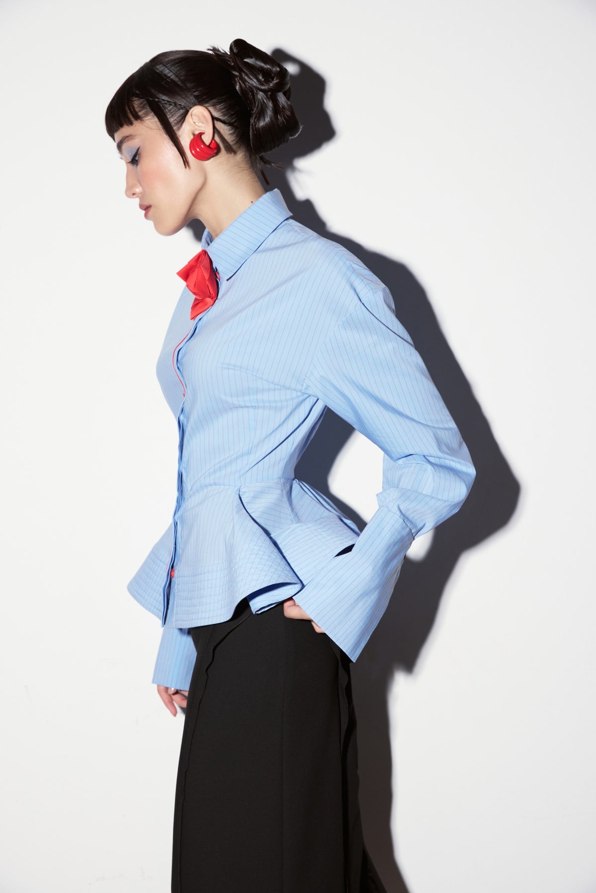 PRAS — blue shirt, profile view with red rose