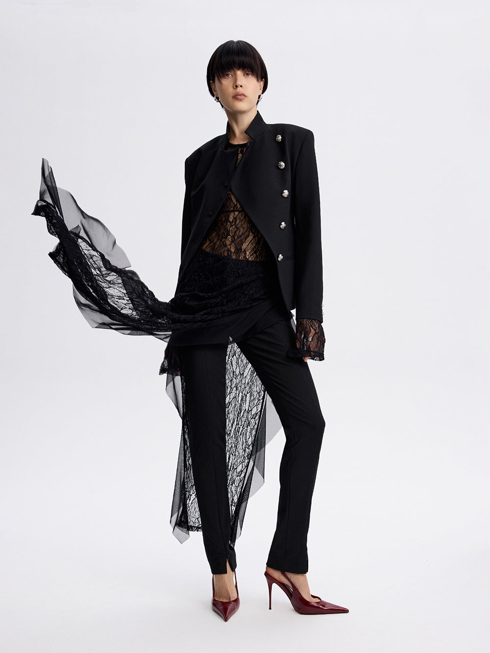 PRAS lace slip dress, styled with a tailored jacket