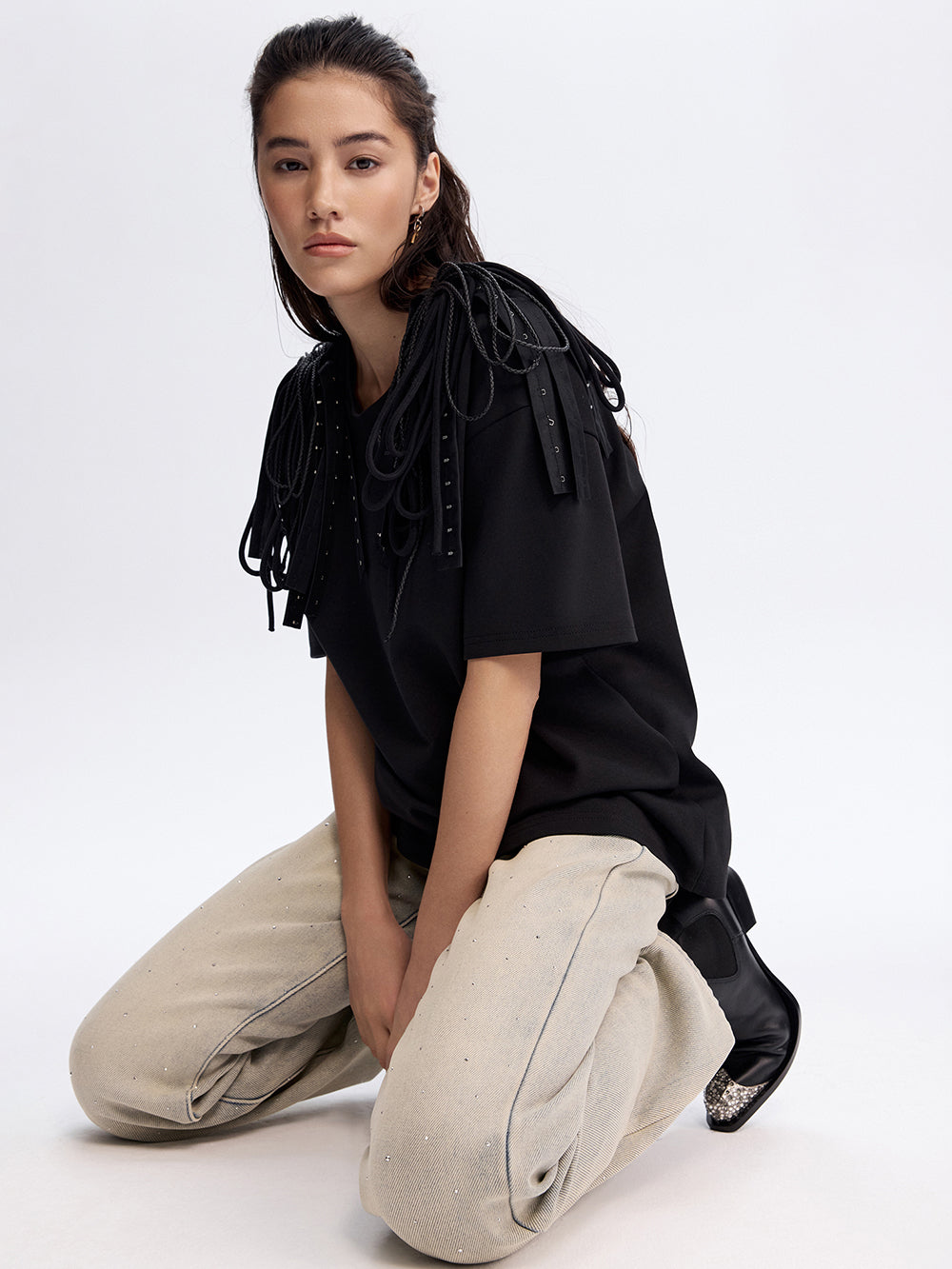 Corded Epaulette Tee in black, worn with ecru trousers