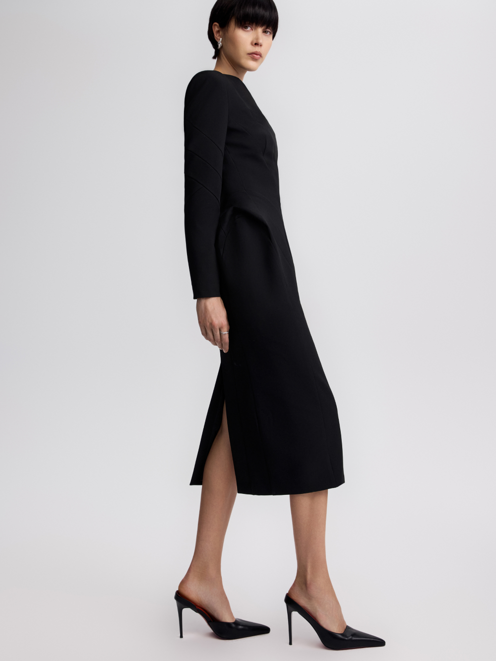 PRAS sculpted sheath dress in black, side with vent