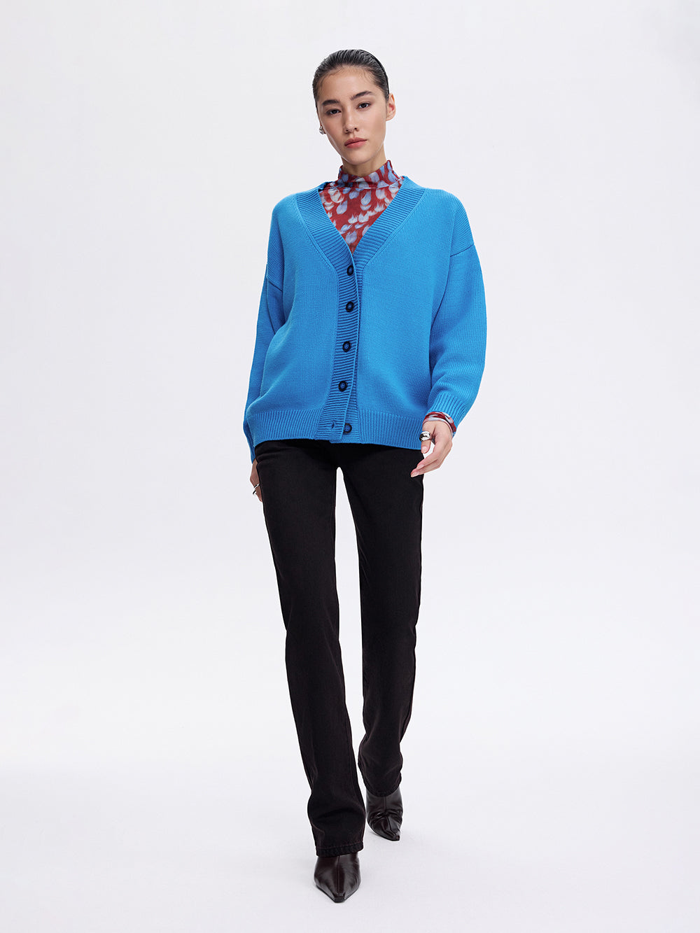 Dark cherry jeans styled with a blue cardigan