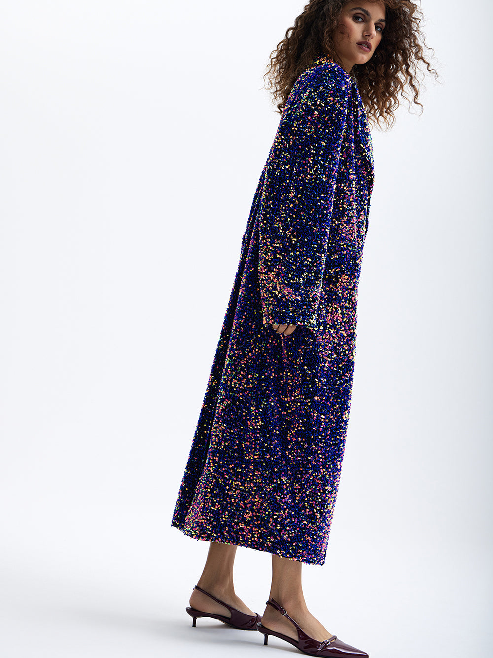 PRAS purple sequin maxi coat, side, walking
