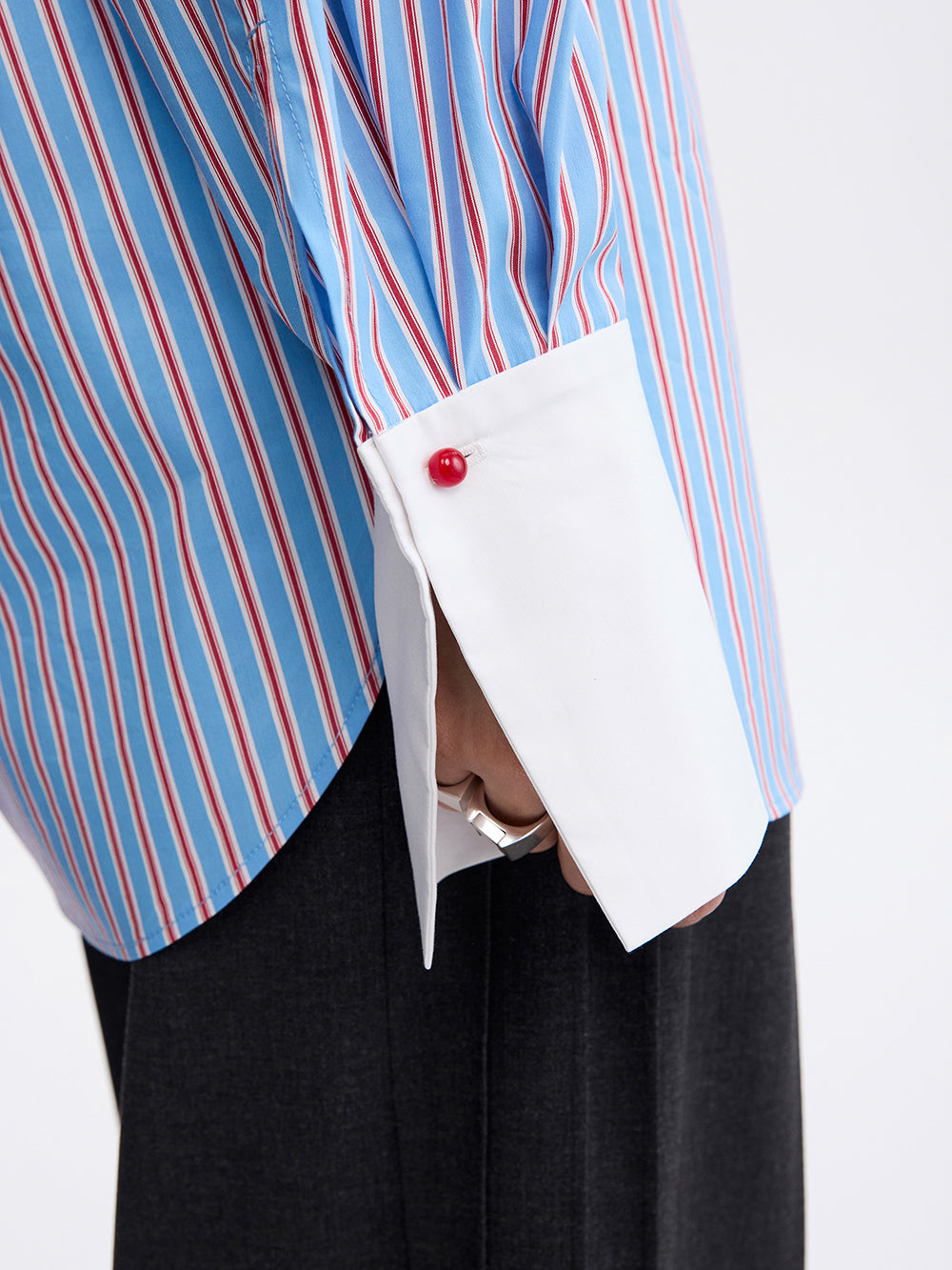 PRAS origami pocket shirt, contrast cuff with red button