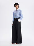 PRAS relief palazzo trousers in dark grey, hand in pocket