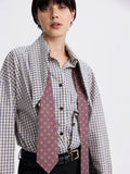 Polka dot silk-lined tie styled on a checked shirt