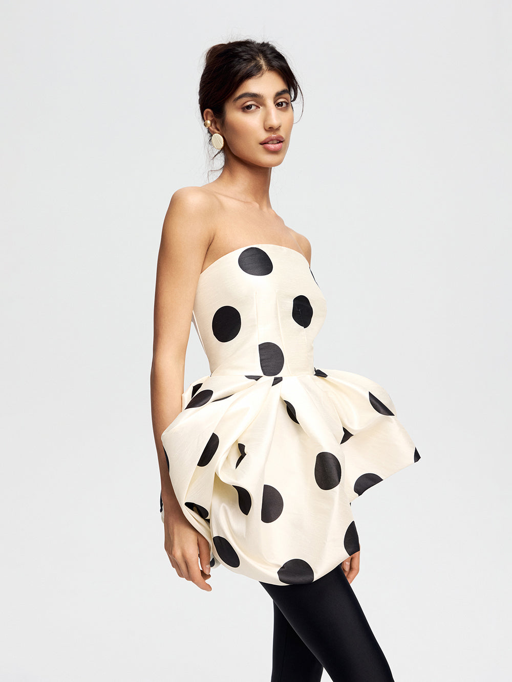 Top with an asymmetrical peplum