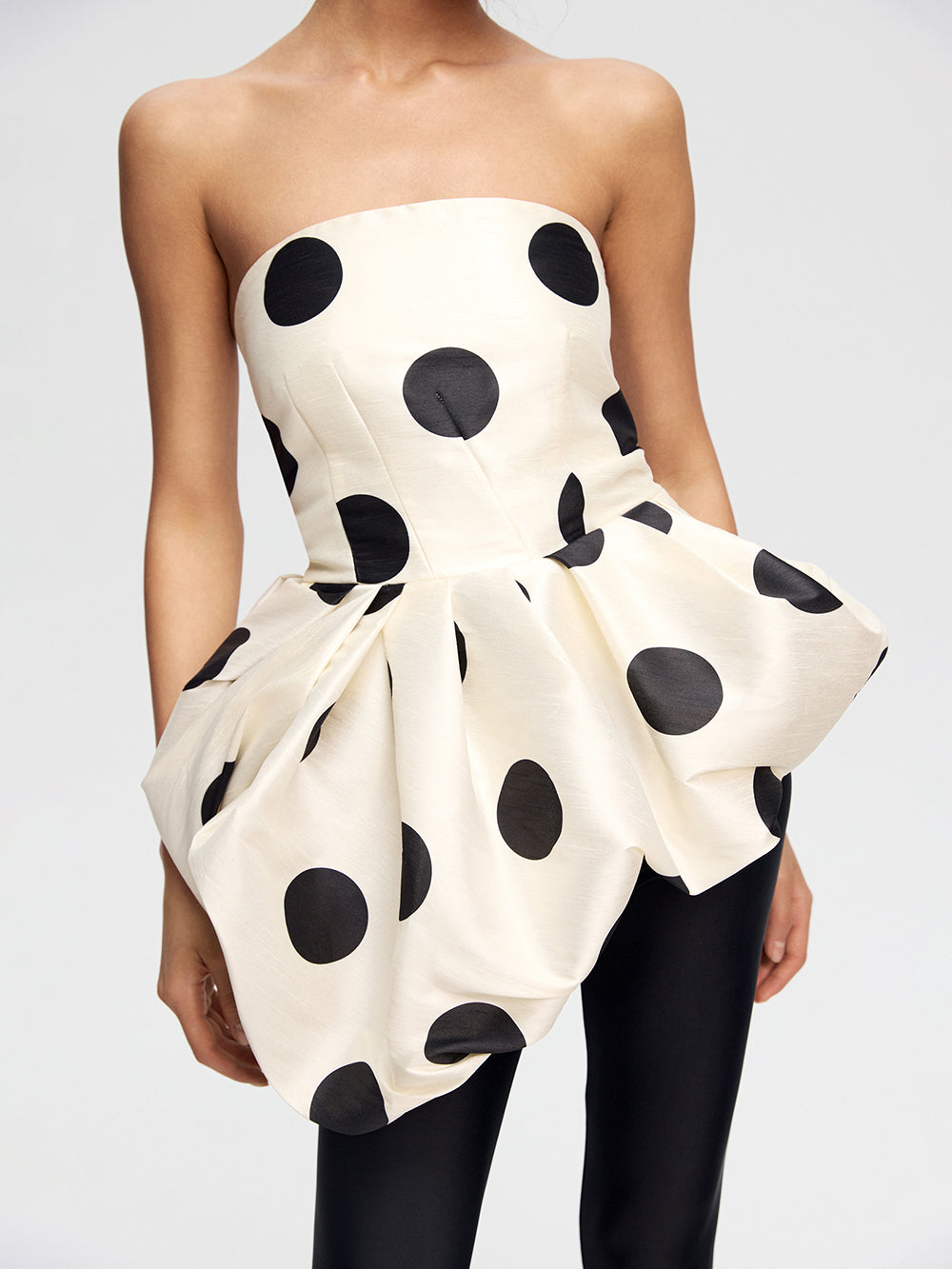 Top with an asymmetrical peplum