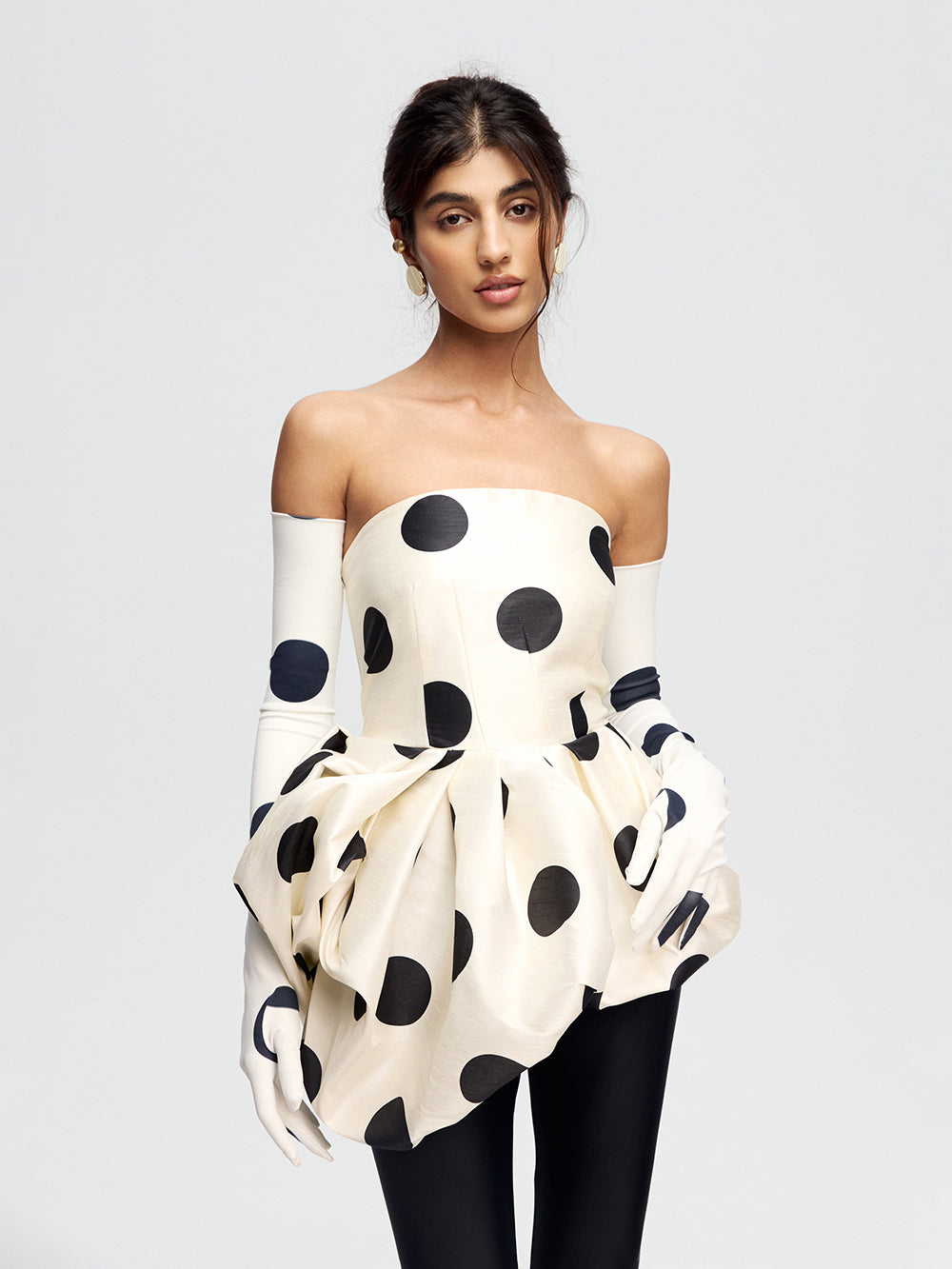 Top with an asymmetrical peplum