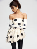 Top with an asymmetrical peplum