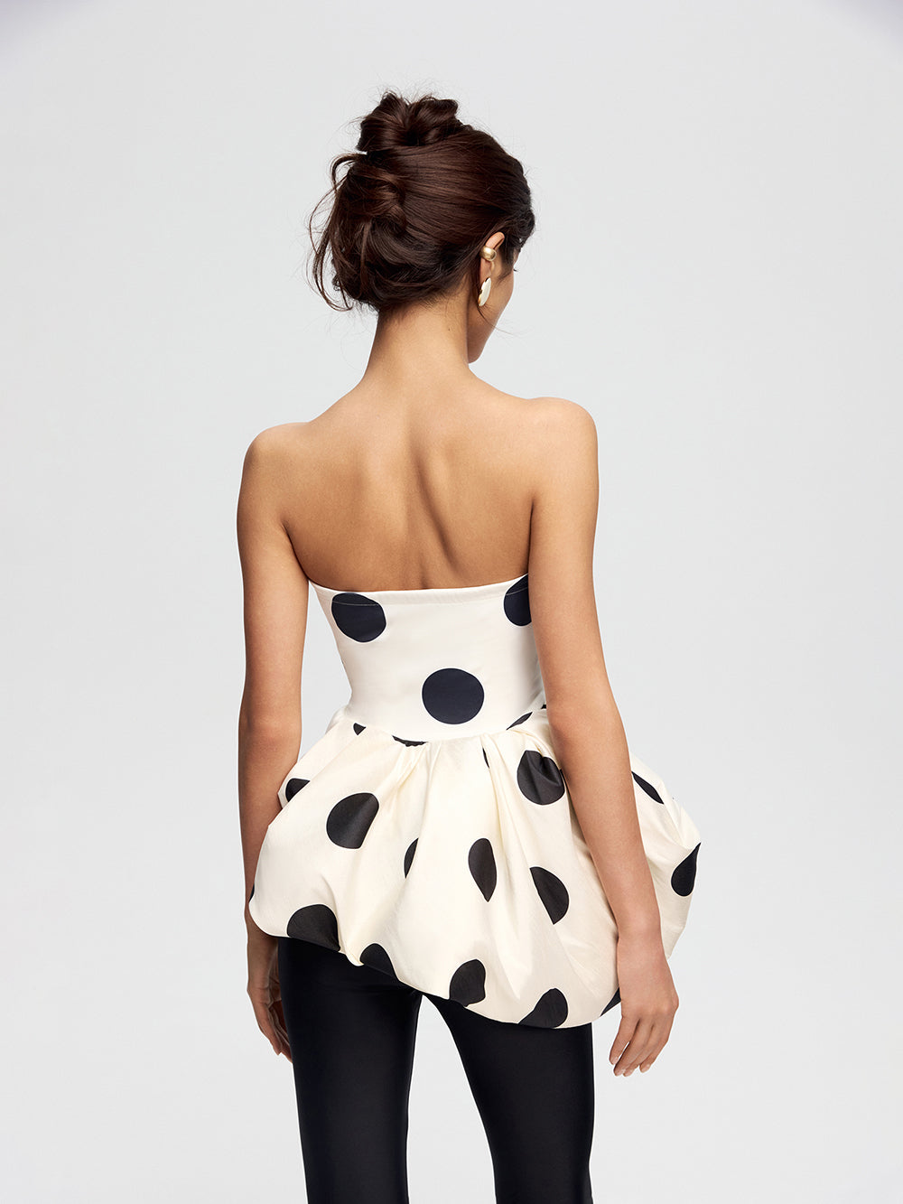 Top with an asymmetrical peplum