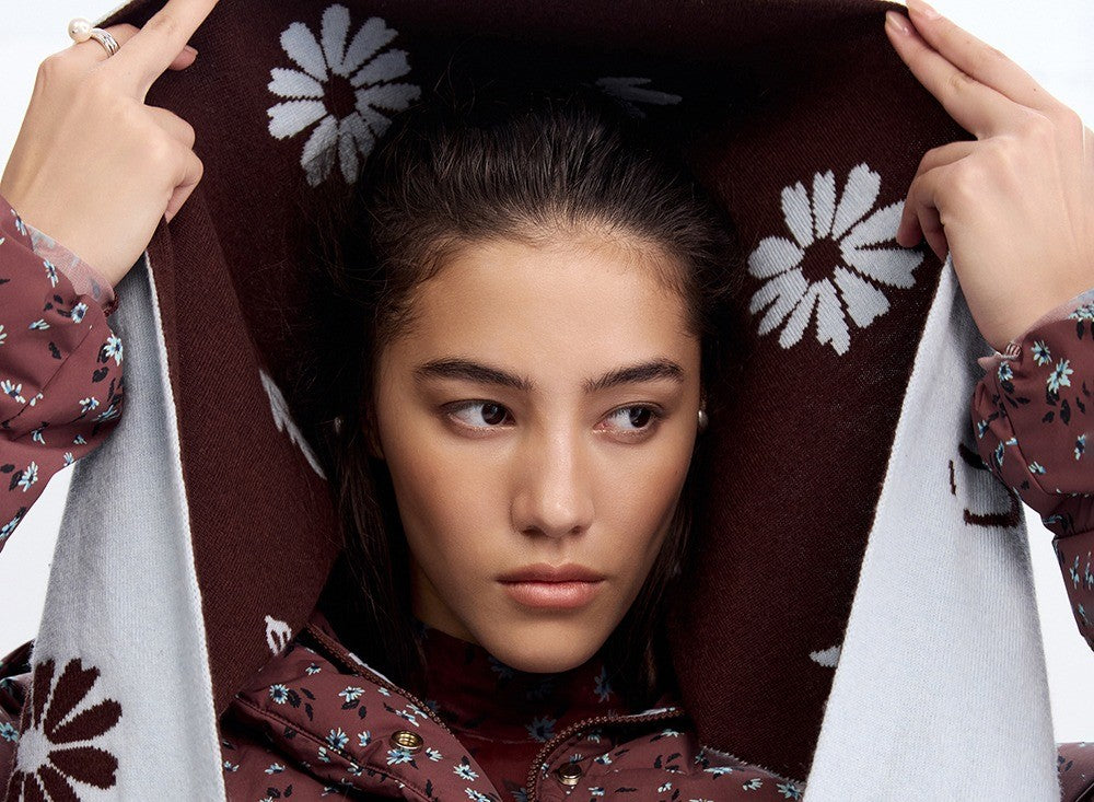 Model wearing the floral wool-cashmere headscarf over the hair